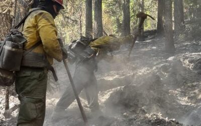 Minimal smoke visible from East Evans Creek Fire as crews continue to mop-up and strengthen control lines; evacuation levels downgraded