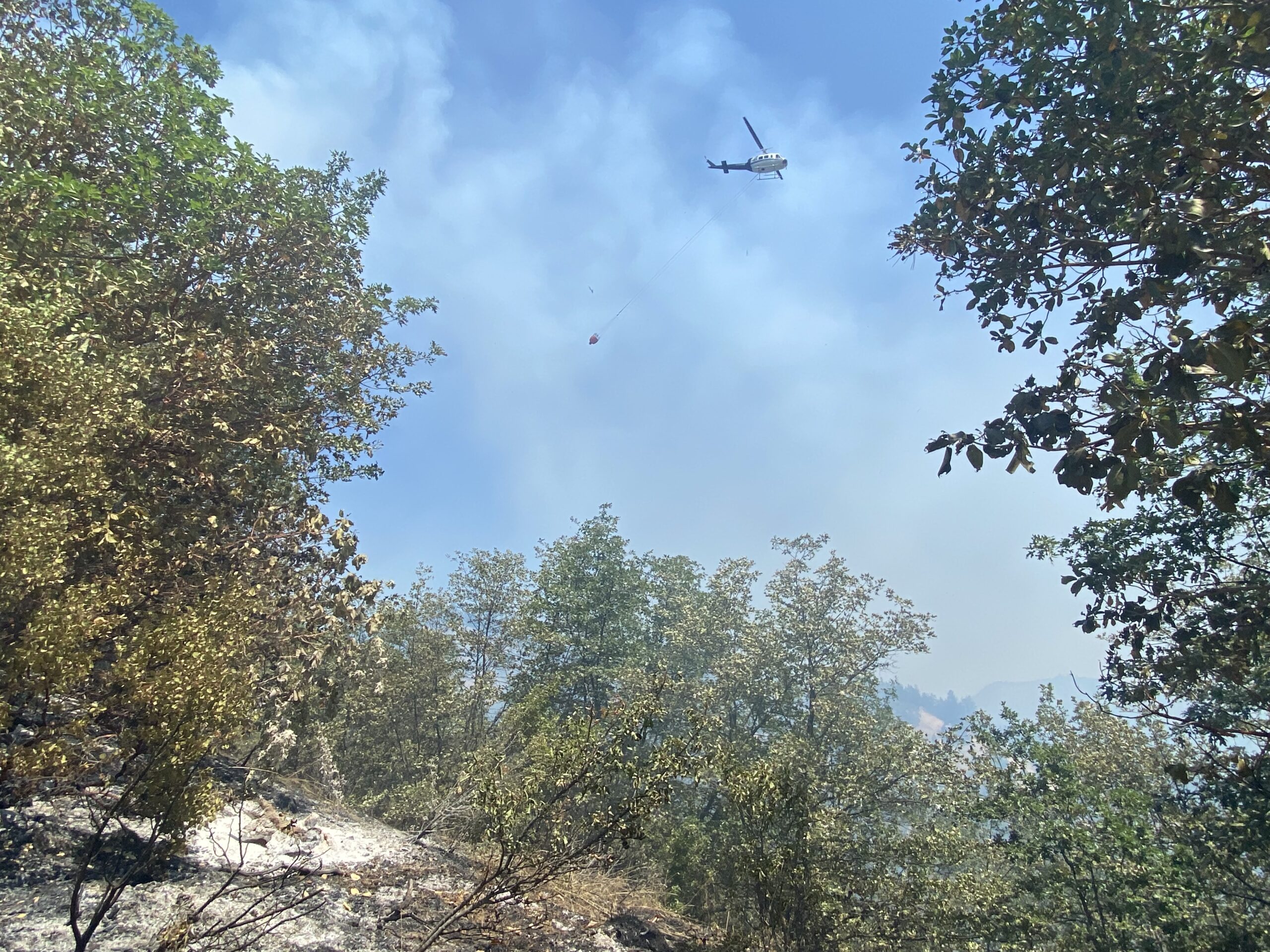 A helicopter on the Wards Creek Fire